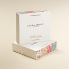 Laura Ashley perfume packaging on a beige background