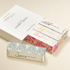 Laura Ashley assorted boxes of fragrance products with floral and nature-themed designs on a beige background