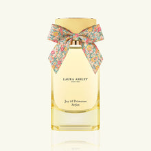 Laura Ashley Joy of Primrose perfume bottle with a floral bow on a white background
