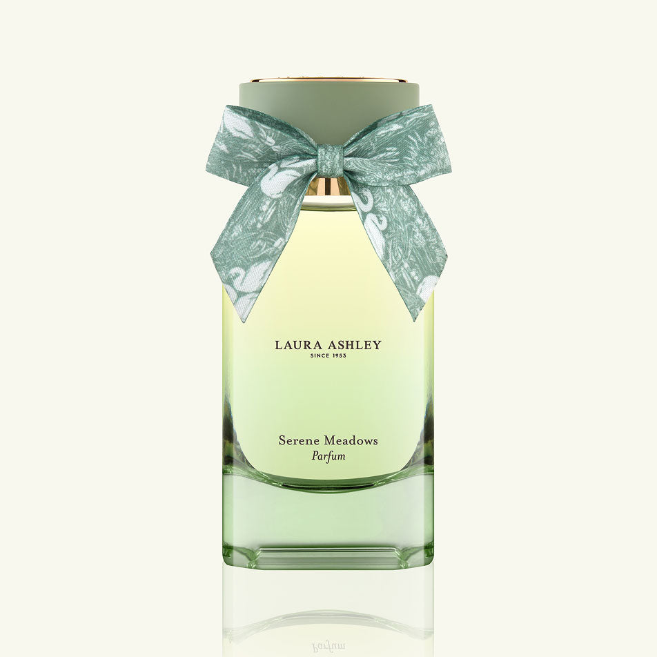 Laura Ashley Serene Meadows perfume bottle with a decorative bow on a white background