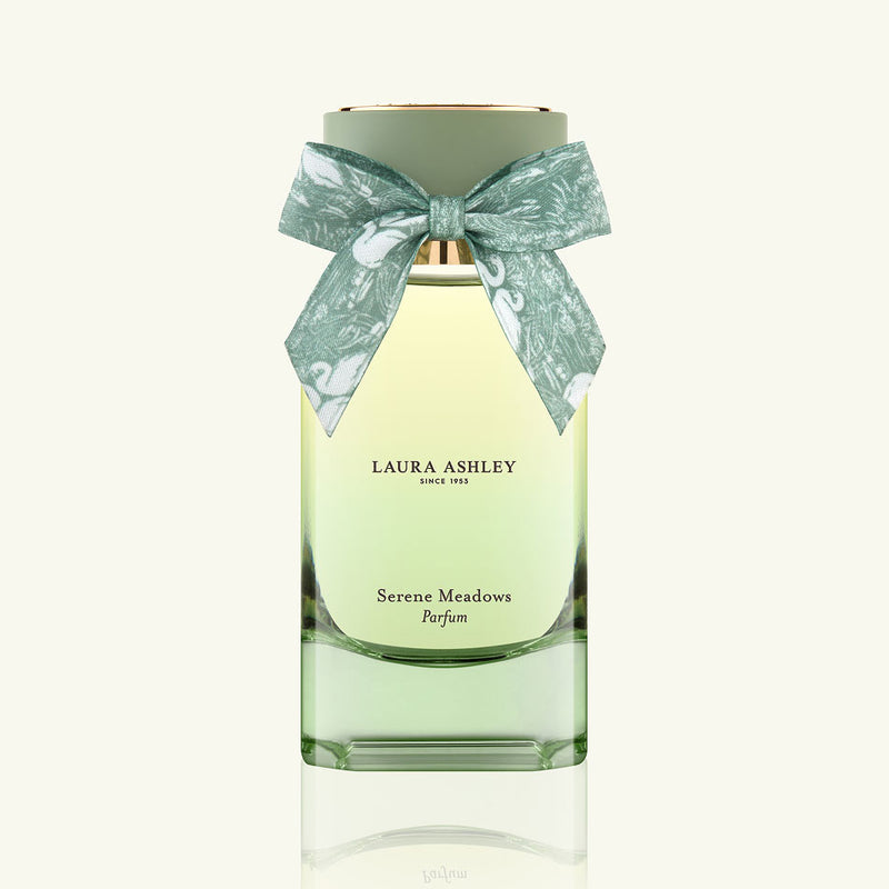 Laura Ashley Serene Meadows perfume bottle with a decorative bow on a white background