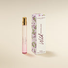Laura Ashley Wild Woodland perfume bottle and packaging on a beige background