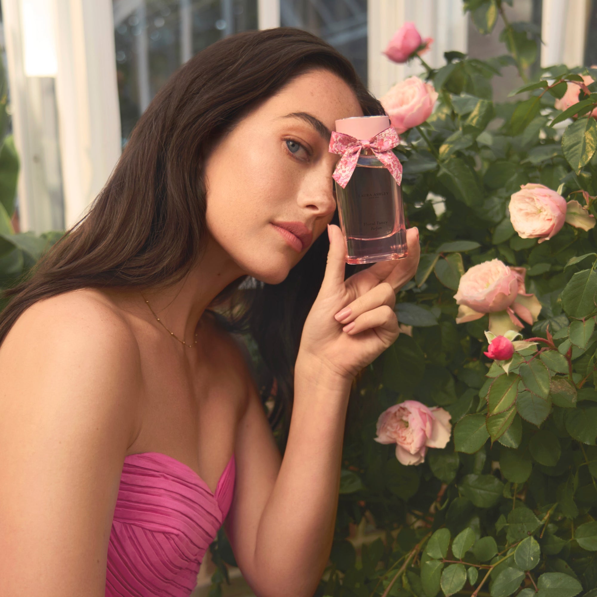 Model holding Floral Fancy Fragrance by Laura Ashley parfum