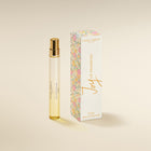 Laura Ashley 'oy of Primrose perfume bottle and packaging on a beige background