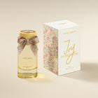 Laura Ashley Joy of Primrose perfume bottle and packaging on a beige background