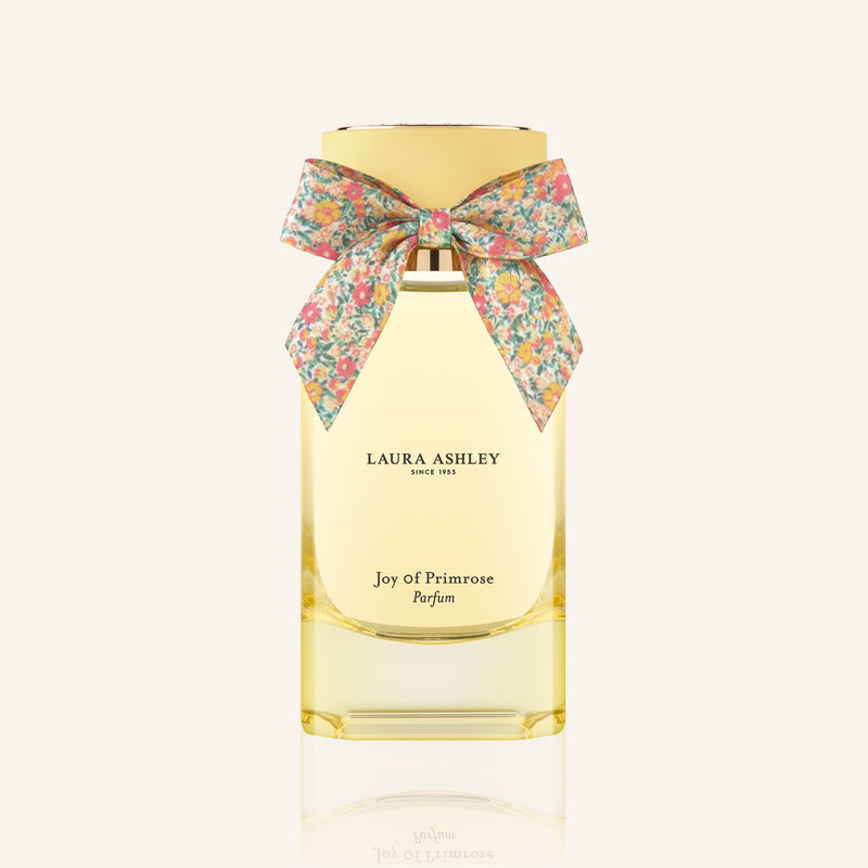 Laura Ashley perfume bottle with a floral bow on a white background